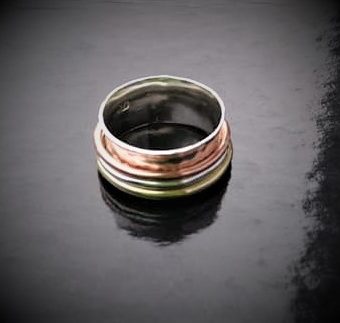silver copper and brass spinner