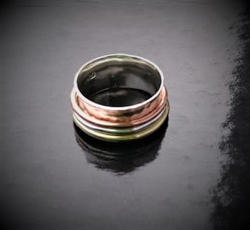 silver copper and brass spinner